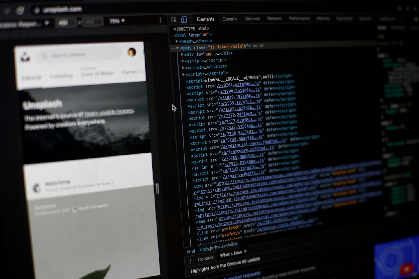 Computer monitor displays lines of website code and image software.